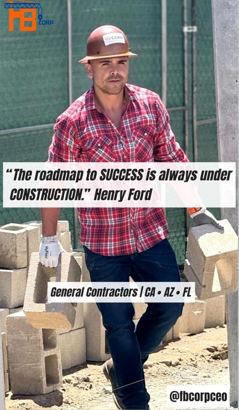 Andrew wearing an FB Corp hard hat on a construction site