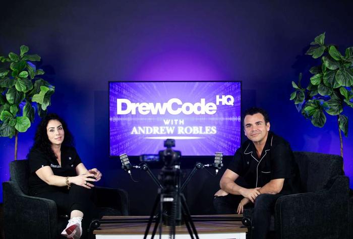 Andrew in conversation with a guest at DrewCode HQ